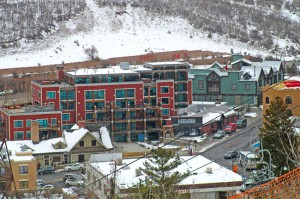 SkyLodge features luxury accommodations, including a three-bedroom penthouse, on Main Street. How close is it to the lifts? Notice the cables in the foreground.