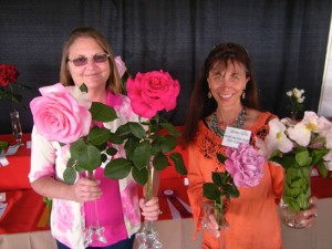Donna Crawley and Rita Perwich in the rose section of the Coronado Flower Show. “Roses are easy to grow if you plant them in the sun, feed them, water them, and pick disease resistant varieties,” said Perwich.